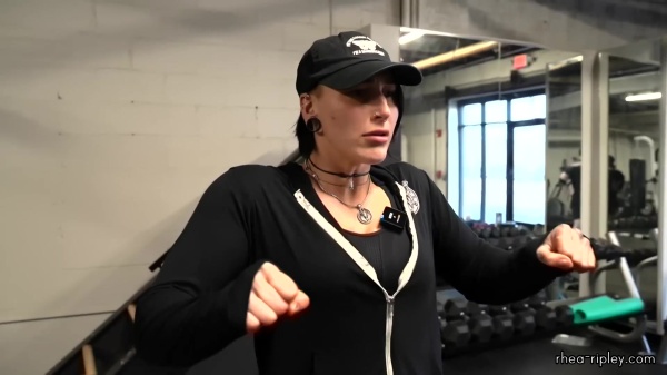 Rhea_Ripley_flexes_on_Sheamus_with_her__Nightmare__Arms_workout_0007.jpg