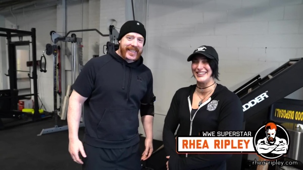 Rhea_Ripley_flexes_on_Sheamus_with_her__Nightmare__Arms_workout_0143.jpg