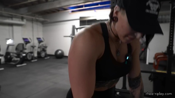 Rhea_Ripley_flexes_on_Sheamus_with_her__Nightmare__Arms_workout_4231.jpg