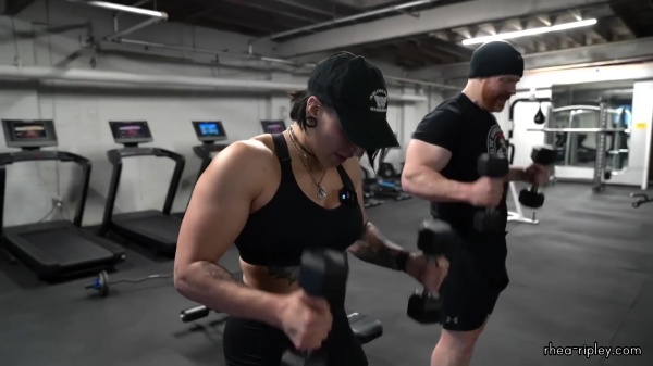 Rhea_Ripley_flexes_on_Sheamus_with_her__Nightmare__Arms_workout_5307.jpg