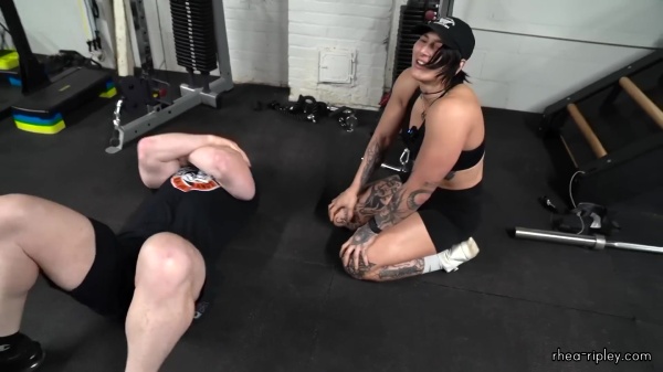 Rhea_Ripley_flexes_on_Sheamus_with_her__Nightmare__Arms_workout_5760.jpg