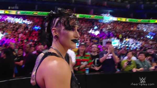 WWE_Money_In_The_Bank_2023_Rhea_Ringside_Attacks_Cody_0754.jpg