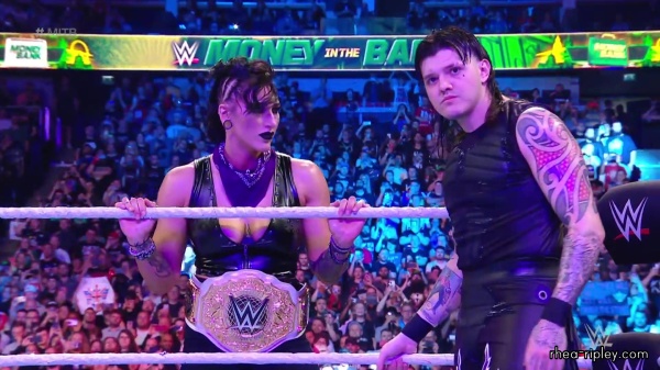 WWE_Money_In_The_Bank_2023_Rhea_Ringside_Attacks_Cody_0901.jpg