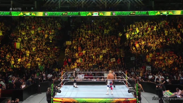 WWE_Money_In_The_Bank_2023_Rhea_Ringside_Attacks_Cody_1054.jpg