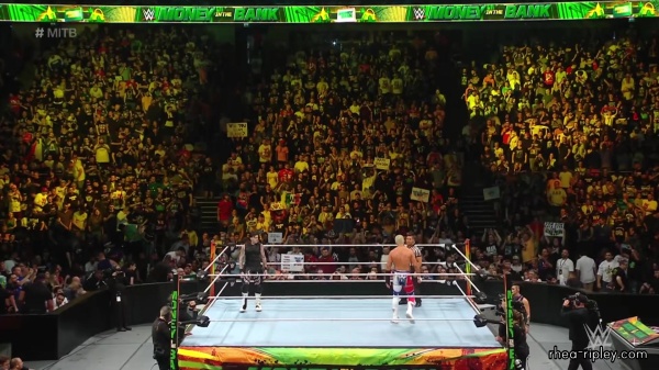 WWE_Money_In_The_Bank_2023_Rhea_Ringside_Attacks_Cody_1060.jpg