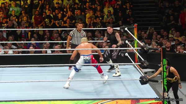 WWE_Money_In_The_Bank_2023_Rhea_Ringside_Attacks_Cody_1124.jpg