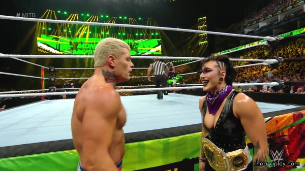 WWE_Money_In_The_Bank_2023_Rhea_Ringside_Attacks_Cody_1318.jpg