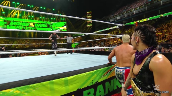 WWE_Money_In_The_Bank_2023_Rhea_Ringside_Attacks_Cody_1332.jpg