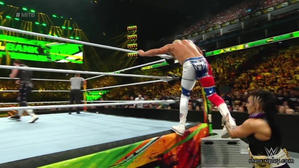 WWE_Money_In_The_Bank_2023_Rhea_Ringside_Attacks_Cody_1347.jpg