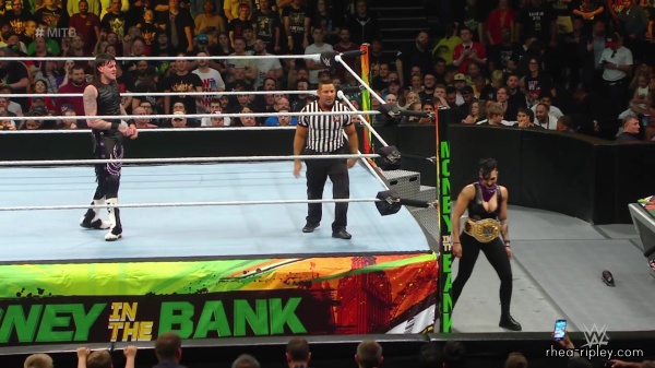 WWE_Money_In_The_Bank_2023_Rhea_Ringside_Attacks_Cody_1399.jpg