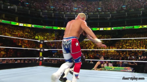 WWE_Money_In_The_Bank_2023_Rhea_Ringside_Attacks_Cody_1480.jpg