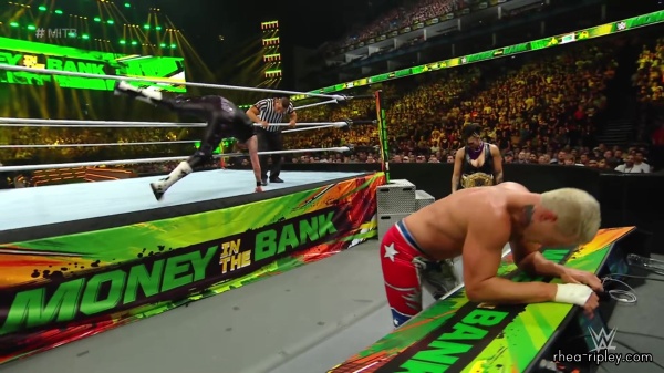 WWE_Money_In_The_Bank_2023_Rhea_Ringside_Attacks_Cody_1491.jpg