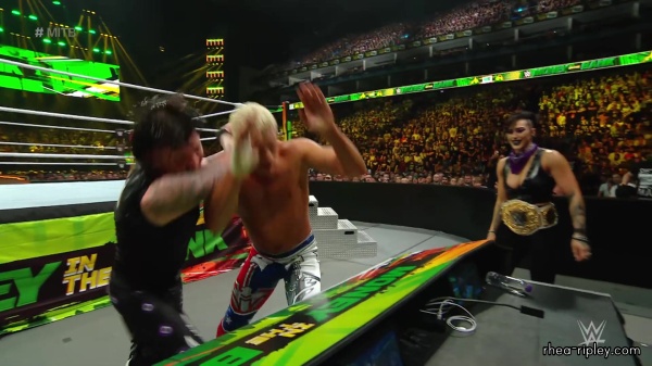 WWE_Money_In_The_Bank_2023_Rhea_Ringside_Attacks_Cody_1501.jpg