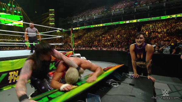 WWE_Money_In_The_Bank_2023_Rhea_Ringside_Attacks_Cody_1509.jpg