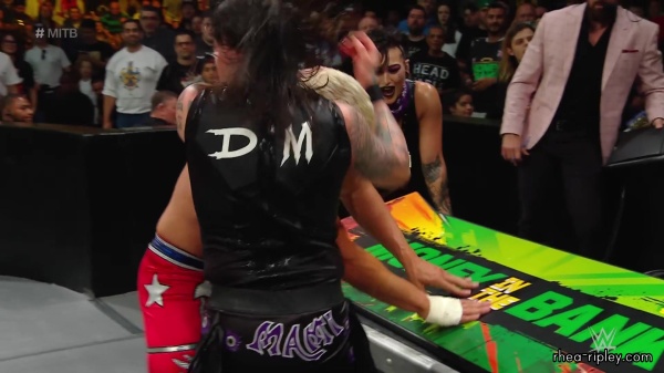 WWE_Money_In_The_Bank_2023_Rhea_Ringside_Attacks_Cody_1513.jpg