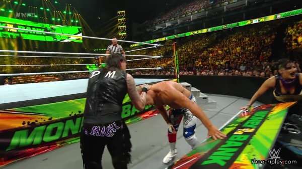 WWE_Money_In_The_Bank_2023_Rhea_Ringside_Attacks_Cody_1518.jpg
