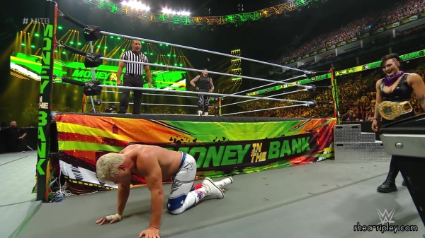 WWE_Money_In_The_Bank_2023_Rhea_Ringside_Attacks_Cody_1543.jpg