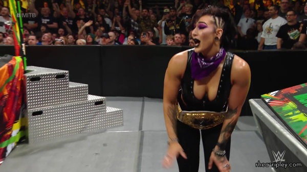 WWE_Money_In_The_Bank_2023_Rhea_Ringside_Attacks_Cody_1556.jpg