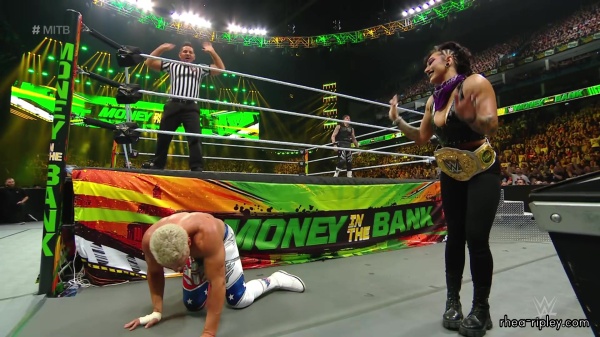 WWE_Money_In_The_Bank_2023_Rhea_Ringside_Attacks_Cody_1560.jpg