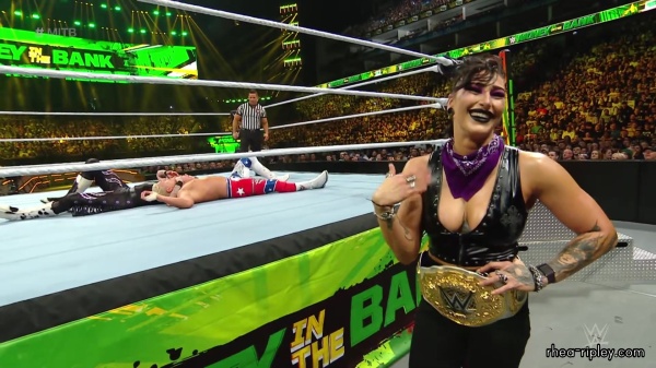 WWE_Money_In_The_Bank_2023_Rhea_Ringside_Attacks_Cody_1707.jpg