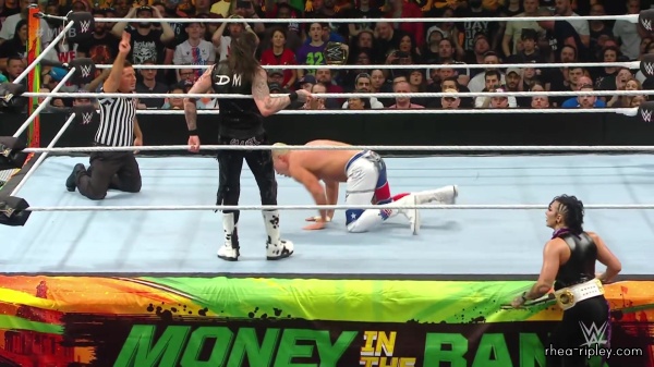WWE_Money_In_The_Bank_2023_Rhea_Ringside_Attacks_Cody_1798.jpg