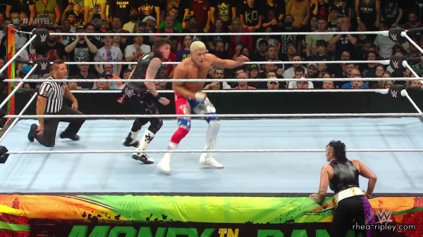 WWE_Money_In_The_Bank_2023_Rhea_Ringside_Attacks_Cody_1803.jpg