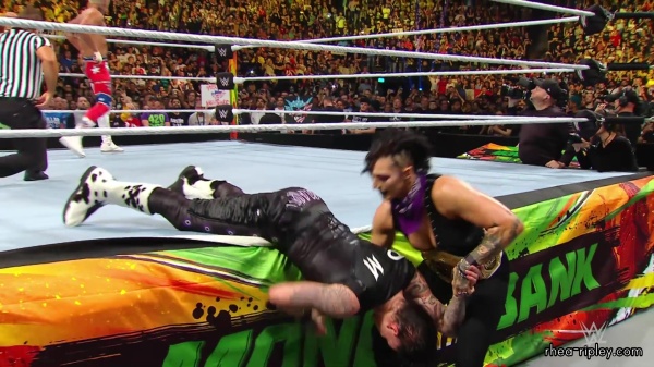 WWE_Money_In_The_Bank_2023_Rhea_Ringside_Attacks_Cody_1901.jpg