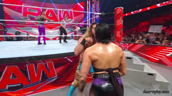 WWE_Raw_05_29_23_Rhea_Ringside_Seth_Puts_Arm_On_Rhea_470.jpg