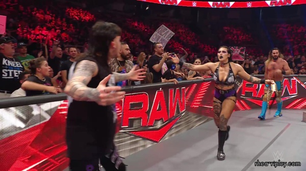 WWE_Raw_05_29_23_Rhea_Ringside_Seth_Puts_Arm_On_Rhea_490.jpg