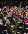 Rhea_Ripley_celebrates_with_the_NXT_Universe_108.jpg