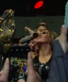 Rhea_Ripley_celebrates_with_the_NXT_Universe_201.jpg