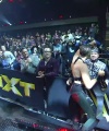 Rhea_Ripley_celebrates_with_the_NXT_Universe_480.jpg