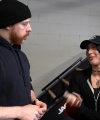 Rhea_Ripley_flexes_on_Sheamus_with_her__Nightmare__Arms_workout_0414.jpg