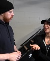 Rhea_Ripley_flexes_on_Sheamus_with_her__Nightmare__Arms_workout_0417.jpg