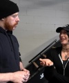 Rhea_Ripley_flexes_on_Sheamus_with_her__Nightmare__Arms_workout_0418.jpg