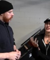 Rhea_Ripley_flexes_on_Sheamus_with_her__Nightmare__Arms_workout_0422.jpg
