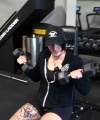 Rhea_Ripley_flexes_on_Sheamus_with_her__Nightmare__Arms_workout_1050.jpg