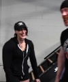 Rhea_Ripley_flexes_on_Sheamus_with_her__Nightmare__Arms_workout_2229.jpg