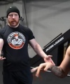 Rhea_Ripley_flexes_on_Sheamus_with_her__Nightmare__Arms_workout_3596.jpg