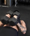 Rhea_Ripley_flexes_on_Sheamus_with_her__Nightmare__Arms_workout_3773.jpg