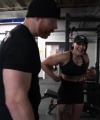 Rhea_Ripley_flexes_on_Sheamus_with_her__Nightmare__Arms_workout_4027.jpg