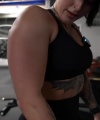 Rhea_Ripley_flexes_on_Sheamus_with_her__Nightmare__Arms_workout_4219.jpg