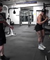 Rhea_Ripley_flexes_on_Sheamus_with_her__Nightmare__Arms_workout_4480.jpg