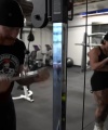 Rhea_Ripley_flexes_on_Sheamus_with_her__Nightmare__Arms_workout_4724.jpg