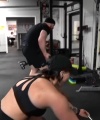 Rhea_Ripley_flexes_on_Sheamus_with_her__Nightmare__Arms_workout_5248.jpg