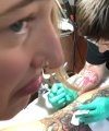Rhea_Ripley_gets_a_tattoo21_606.jpg