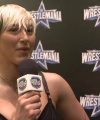 Rhea_Ripley_on_Women_s_Tag_Titles2C_Charlotte_Flair2C_WrestleMania_1582.jpg