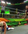 WWE_Money_In_The_Bank_2023_Rhea_Ringside_Attacks_Cody_1561.jpg