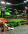 WWE_Money_In_The_Bank_2023_Rhea_Ringside_Attacks_Cody_1562.jpg