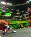 WWE_Money_In_The_Bank_2023_Rhea_Ringside_Attacks_Cody_1563.jpg